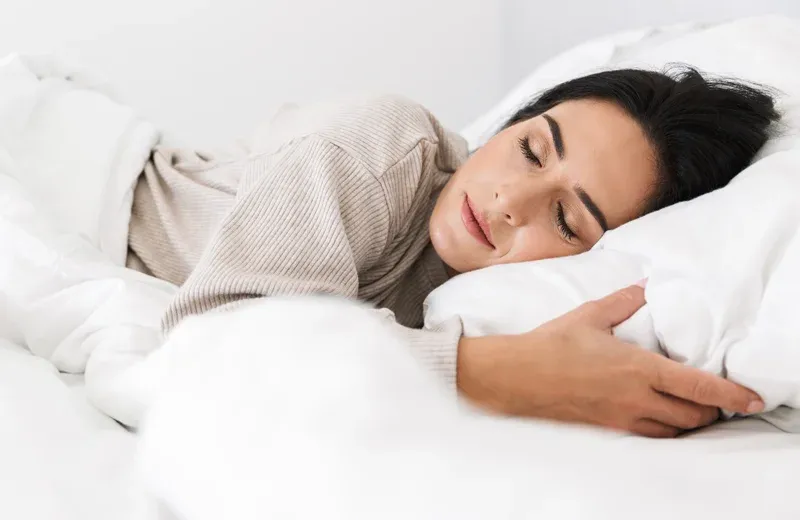 woman sleeping in bed bug free bed