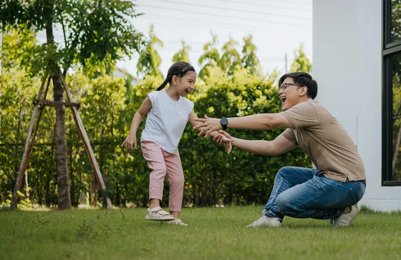 family playing outside in mosquito free yard