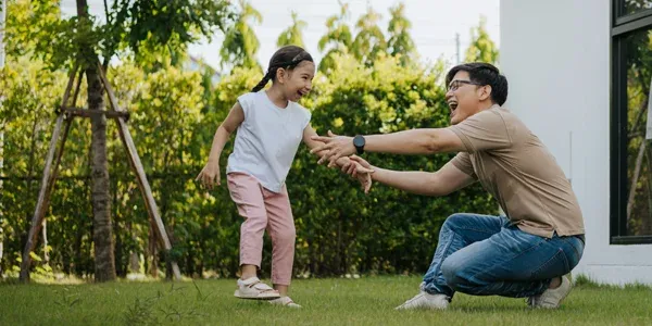 family playing outside in mosquito free yard